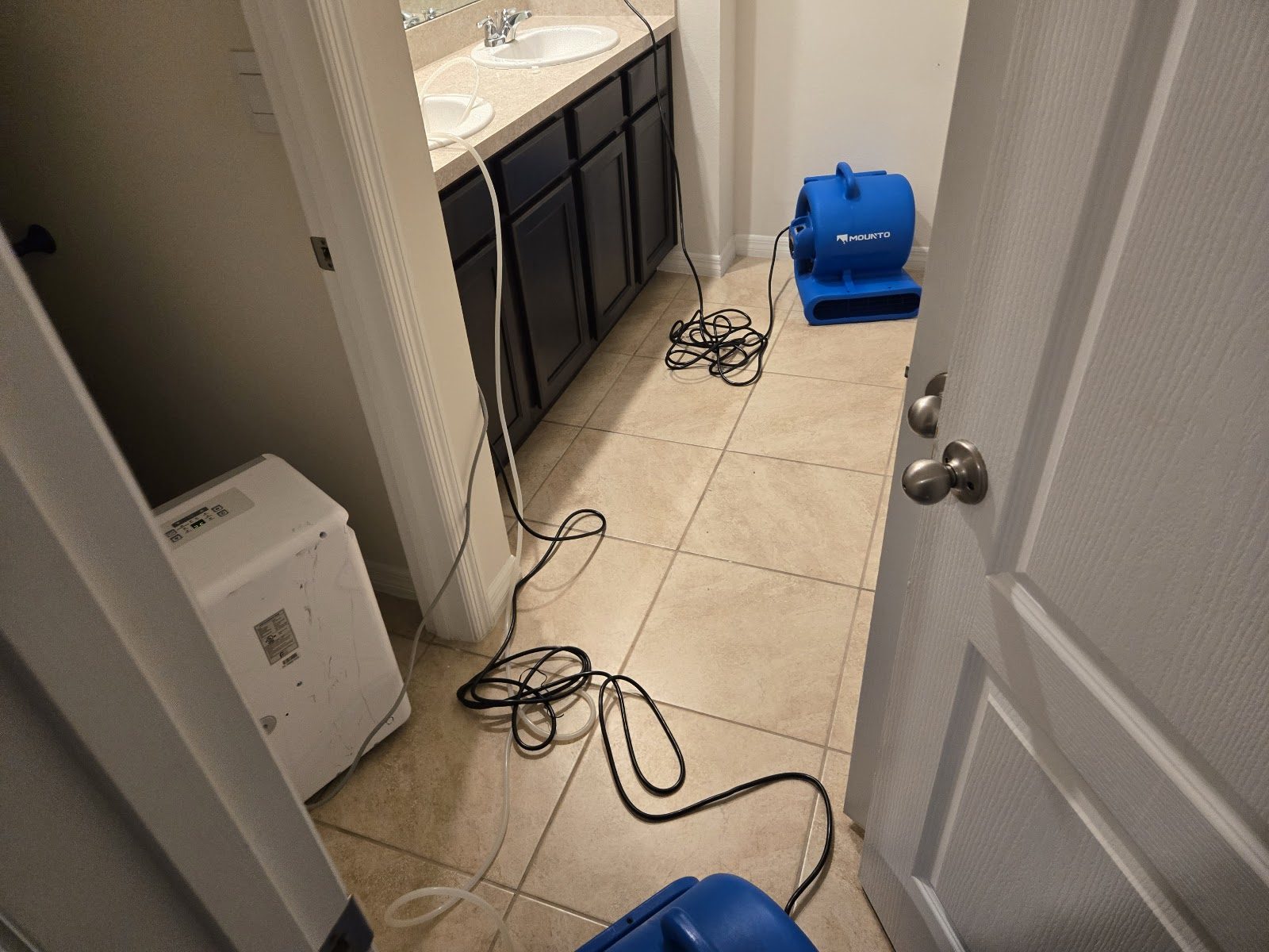 Onsite Mitigation & Restoration drying equipment running in a water-damaged Central Florida home